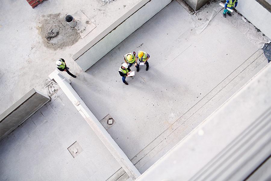 Overhead view of construction workers building new Bozeman commercial building