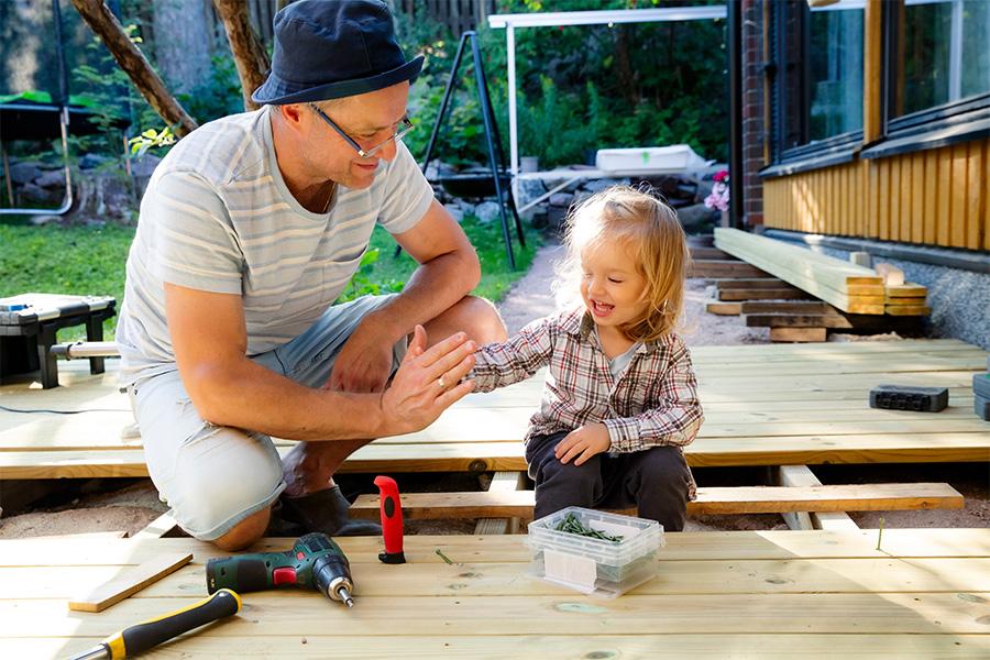 Bozeman family building porch at home with help from Bank of Bozeman's loans.